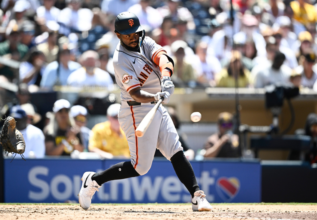 San Francisco Giants' Osleivis Basabe hits a solo home run during the fifth inning of a baseball game against the San Diego Padres, Sunday, Aug. 2, 2026, in San Diego. (AP Photo/Denis Poroy)