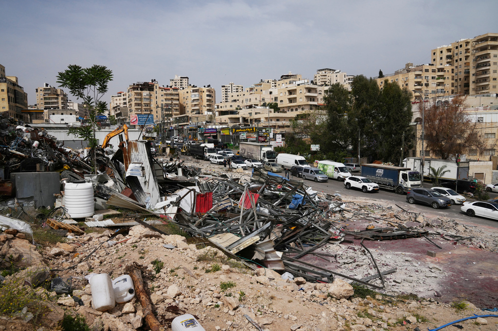 The site of an Israeli army demolition campaign that targeted several Palestinian commercial structures overnight, days after the issue of demolition and evacuation orders to owners, in the West Bank town of Al-Eizariya Tuesday, May 12, 2026. (AP Photo/Mahmoud Illean)