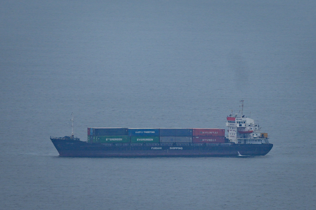 A cargo ship sails in the Persian Gulf towards Dubai port as seen from Ajman, United Arab Emirates, Tuesday, April 14, 2026. (AP Photo)
