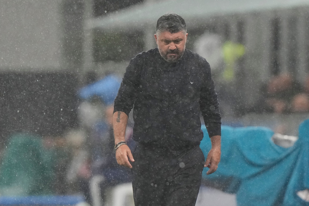 Italy's head coach Gennaro Gattuso walks under the rain before the start of the 2026 World Cup Group I qualifier soccer match between Italy and Norway in Milan, Italy, Sunday, Nov. 16, 2025. (AP Photo/Luca Bruno)