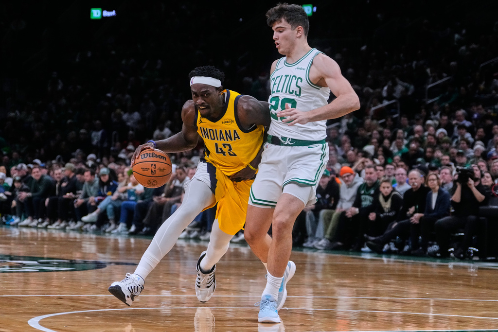 Indiana Pacers forward Pascal Siakam (43) drives to the basket against Boston Celtics guard Hugo Gonzalez (28) during the first half of an NBA basketball game, Monday, Dec. 22, 2025, in Boston. (AP Photo/Charles Krupa)