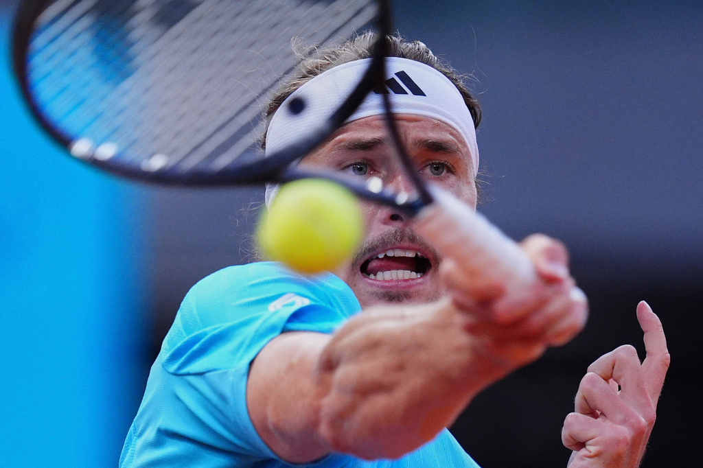 Germany's Alexander Zverev returns the ball to Alexander Blockx of Belgium during their men's singles semifinal match at the Madrid Open tennis tournament in Madrid, Spain, Friday, May 1, 2026. (AP Photo/Manu Fernandez)