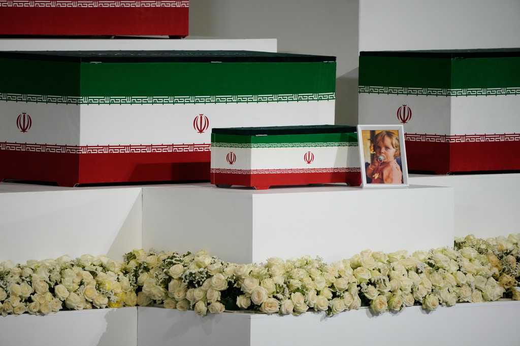 The casket of slain Iranian Supreme Leader Ayatollah Ali Khamenei's granddaughter, Zahra Mohammadi Golpayegani, is displayed alongside the caskets of Khamenei and other members of his family during a viewing ceremony ahead of the dayslong funeral ceremonies at the Imam Khomeini Mosalla Grand Mosque in Tehran, Iran, Friday, July 3, 2026. (AP Photo/Vahid Salemi)
