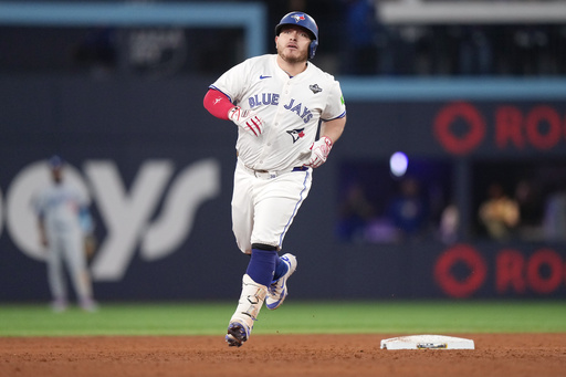 Toronto Blue Jays' Alejandro Kirk rounds the bases after hitting a two-run home run against the Los Angeles Dodgers during the sixth inning in Game 1 of baseball's World Series, Friday, Oct. 24, 2025, in Toronto. (Nathan Denette/The Canadian Press via AP) Toronto Blue Jays' Alejandro Kirk rounds the bases after hitting a two-run home run against the Los Angeles Dodgers during the sixth inning in Game 1 of baseball's World Series, Friday, Oct. 24, 2025, in Toronto. (Nathan Denette/The Canadian Press via AP)