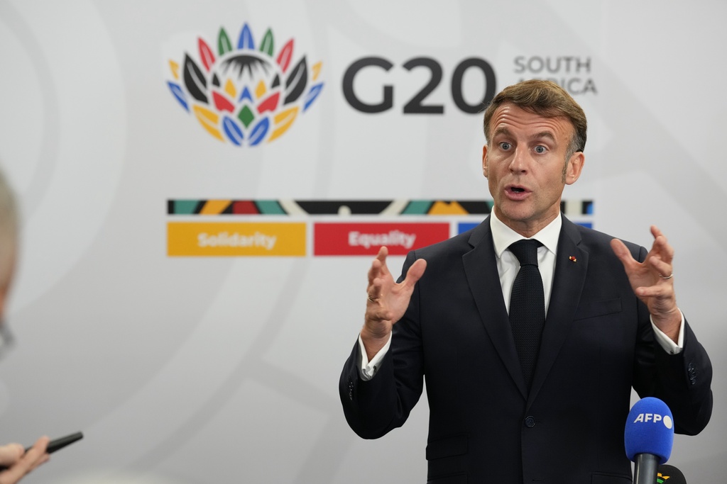 French President Emmanuel Macron speaks to the media at the end of the first day of the G20 leaders' summit in Johannesburg, South Africa, Saturday, Nov. 22, 2025. (AP Photo/Thibault Camus)