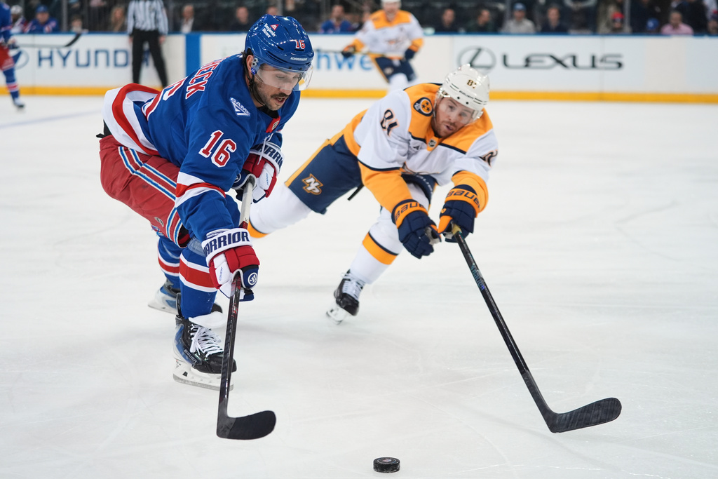 New York Rangers' Vincent Trocheck (16) drives past Nashville Predators' Jonathan Marchessault (81) during the first period of an NHL hockey game Monday, Nov. 10, 2025, in New York. (AP Photo/Frank Franklin II)