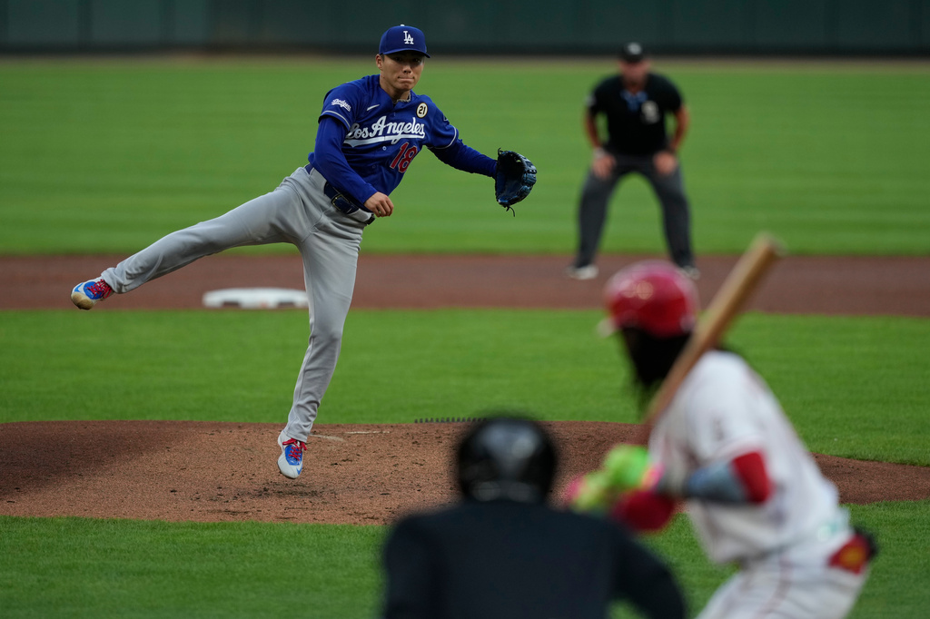 Los Angeles Dodgers pitcher Yoshinobu Yamamoto throws during the first inning of a baseball game against the Cincinnati Reds, Tuesday, Sept. 15, 2026, in Cincinnati. (AP Photo/Carolyn Kaster)