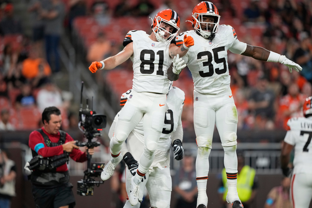Cleveland Browns wide receiver Luke Floriea (81) celebrates with Raheim Sanders (35) after scoring a touchdown during the first half of a preseason NFL football game against the New England Patriots Thursday, Aug. 27, 2026, in Cleveland. (AP Photo/Carolyn Kaster)