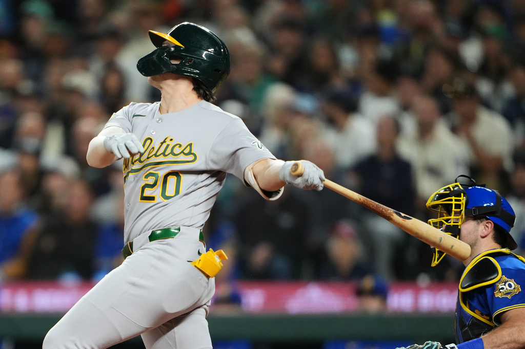Athletics' Zack Gelof follows through on an RBI triple against the Seattle Mariners during the fifth inning of a baseball game, Friday, Sept. 4, 2026, in Seattle. (AP Photo/Lindsey Wasson)
