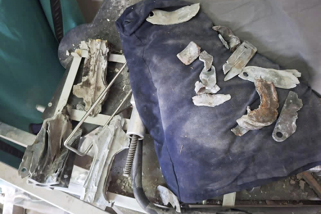 CORRECTS NUMBER OF PROJECTILES FROM ONE TO THREE -- Parts of at least three tank projectiles from Israeli strikes that hit the outside stairs of Nasser Hospital are displayed at the site in Khan Younis, Gaza Strip, Monday, Aug. 25, 2025. (UGC via AP)