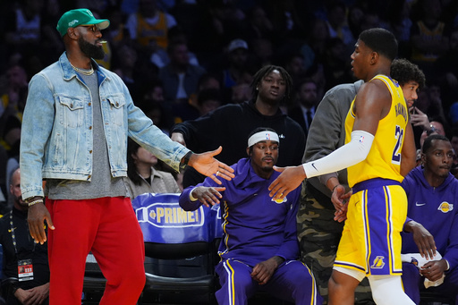 Los Angeles Lakers forward LeBron James (23) greets Los Angeles Lakers forward Rui Hachimura (28) after returning to the bench during the first half of an NBA basketball game Monday, Oct. 27, 2025, in Los Angeles. (AP Photo/Ethan Swope) Los Angeles Lakers forward LeBron James (23) greets Los Angeles Lakers forward Rui Hachimura (28) after returning to the bench during the first half of an NBA basketball game Monday, Oct. 27, 2025, in Los Angeles. (AP Photo/Ethan Swope)