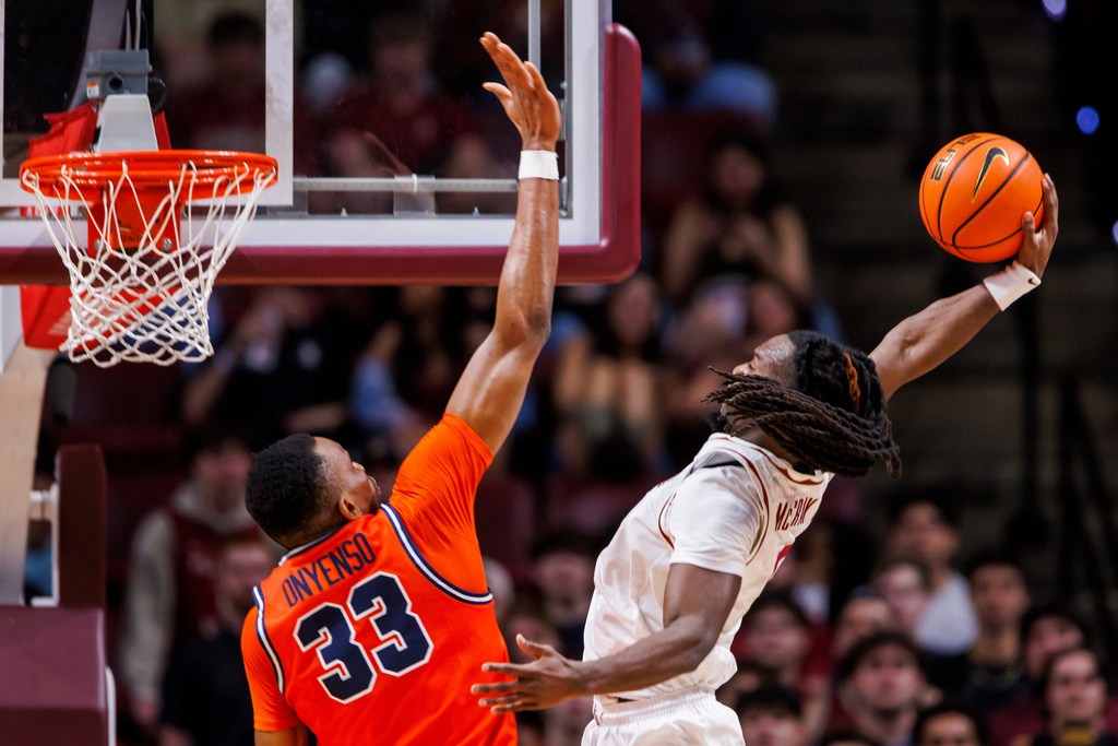 Florida State guard Robert McCray V. (6) dunks over Virginia center Ugonna Onyenso (33) during the first half of an NCAA college basketball game, Tuesday, Feb. 10, 2026, in Tallahassee, Fla. (AP Photo/Colin Hackley)