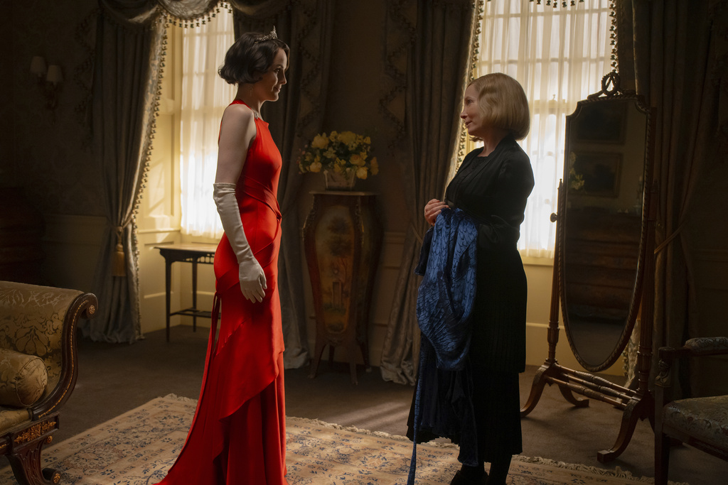 This image released by Focus Features shows Michelle Dockery, left, and Joanne Froggatt in a scene from "Downton Abbey: The Grand Finale." (Focus Feature via AP)