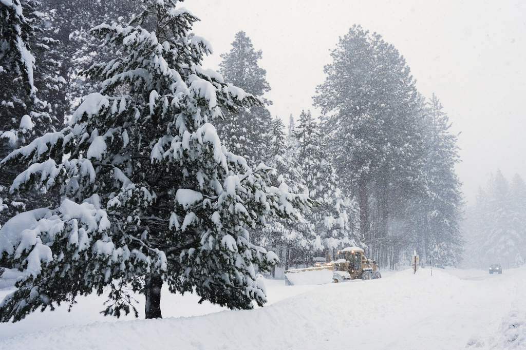 A road is plowed during a snow storm on Tuesday, Feb. 17, 2026 in Truckee Calif. (AP Photos/Brooke Hess-Homeier)
