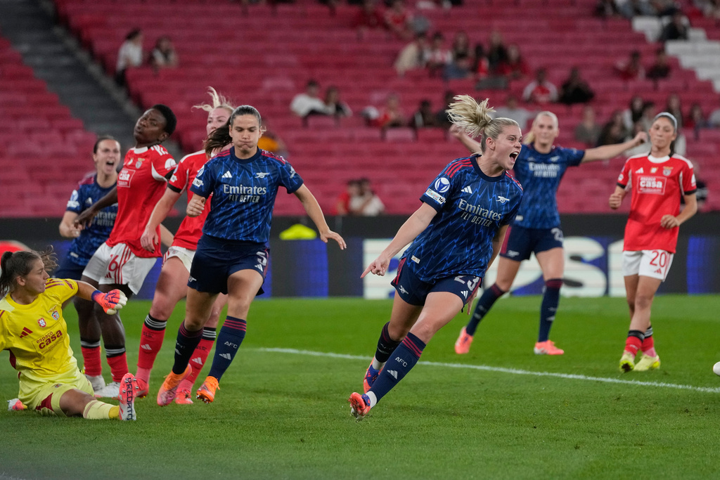 Arsenal's Alessia Russo, centre, celebrates after scoring her side's second goal during the women's Champions League opening phase soccer match between SL Benfica and Arsenal at the Luz Stadium, in Lisbon, Portugal, Thursday, Oct. 16, 2025. (AP Photo/Armando Franca)