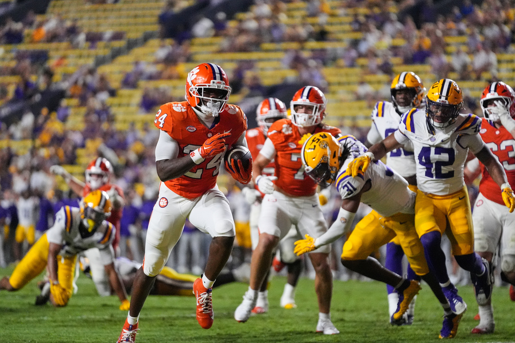 Clemson running back David Eziomume (24) carries for a touchdown against LSU in the second half of an NCAA college football game, Saturday, Sept. 5, 2026 in Baton Rouge, La. (AP Photo/Gerald Herbert)