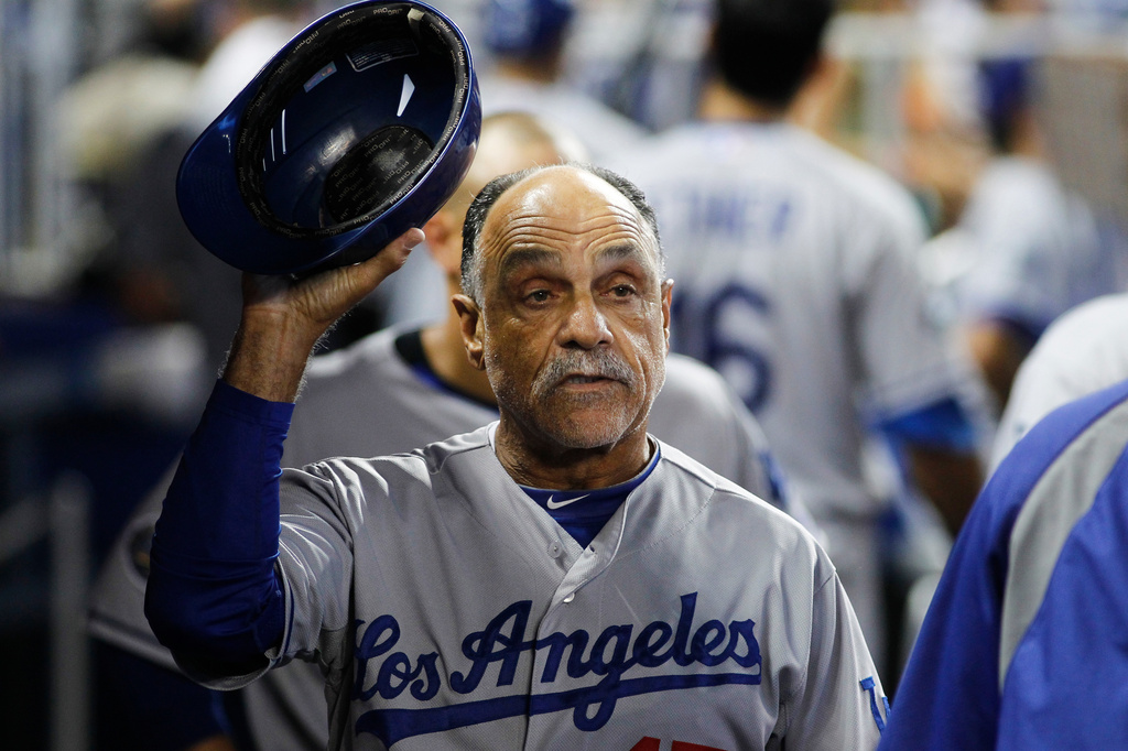 FILE - Los Angeles Dodgers coach Davey Lopes gestures in the dugout during a baseball game in Miami, Sunday, Aug. 12, 2012. (AP Photo/J Pat Carter, File)