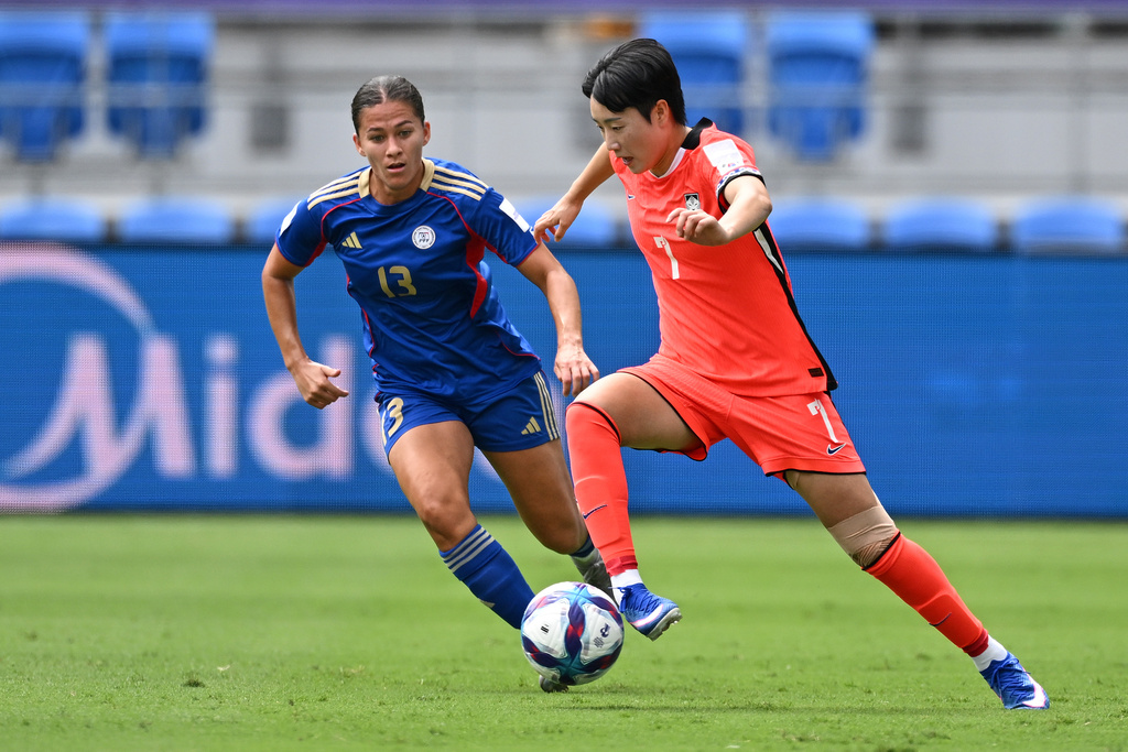 South Korea's Son Haw-yeon, right, and Philippines' Angela Beard compete for the ball during the Women's Asia Cup soccer match between South Korea and the Philippines in Robina, Australia, Thursday, March 5, 2026. (Dave Hunt/AAPImage via AP)