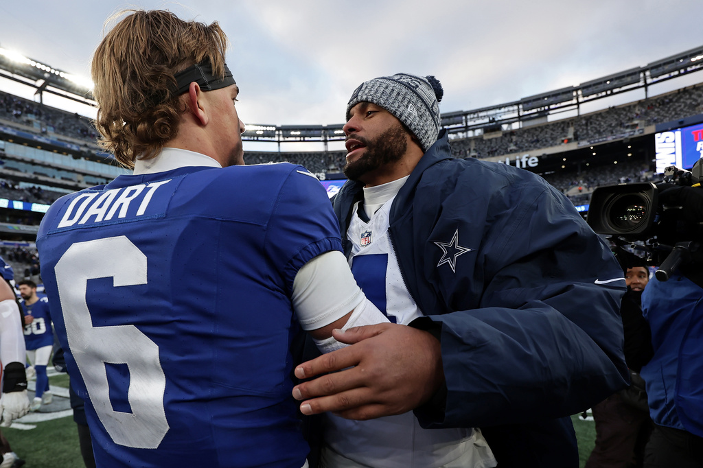 FILE - New York Giants quarterback Jaxson Dart (6) greets Dallas Cowboys quarterback Dak Prescott (4) after an NFL football game on Jan. 4, 2026, in East Rutherford, N.J. (AP Photo/Adam Hunger, File)