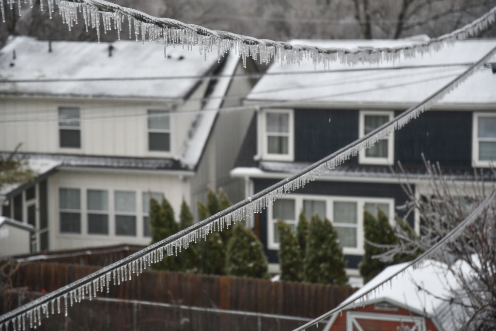 Icicles form on power lines during a winter storm in Nashville, Tenn,, Sunday, Jan,. 25, 2026. (AP Photo/Kristin Hall)
