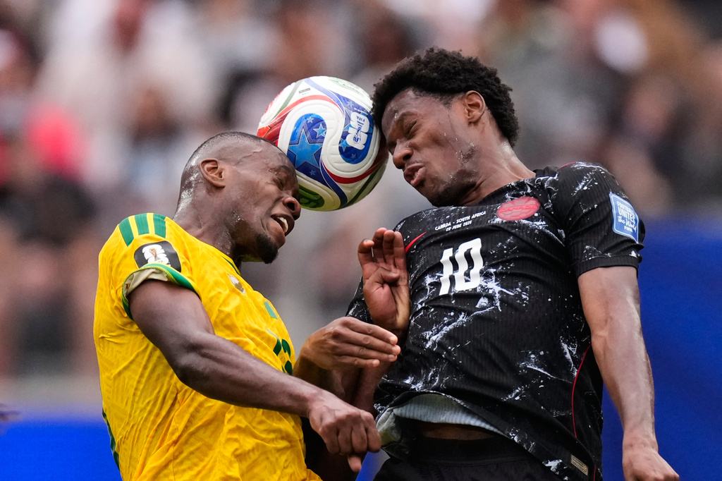 South Africa's Sphephelo Sithole and Canada's Jonathan David (10) go for a header during a World Cup round of 32 soccer match in Inglewood, Calif., near Los Angeles, Sunday, June 28, 2026. (AP Photo/Mark J. Terrill)