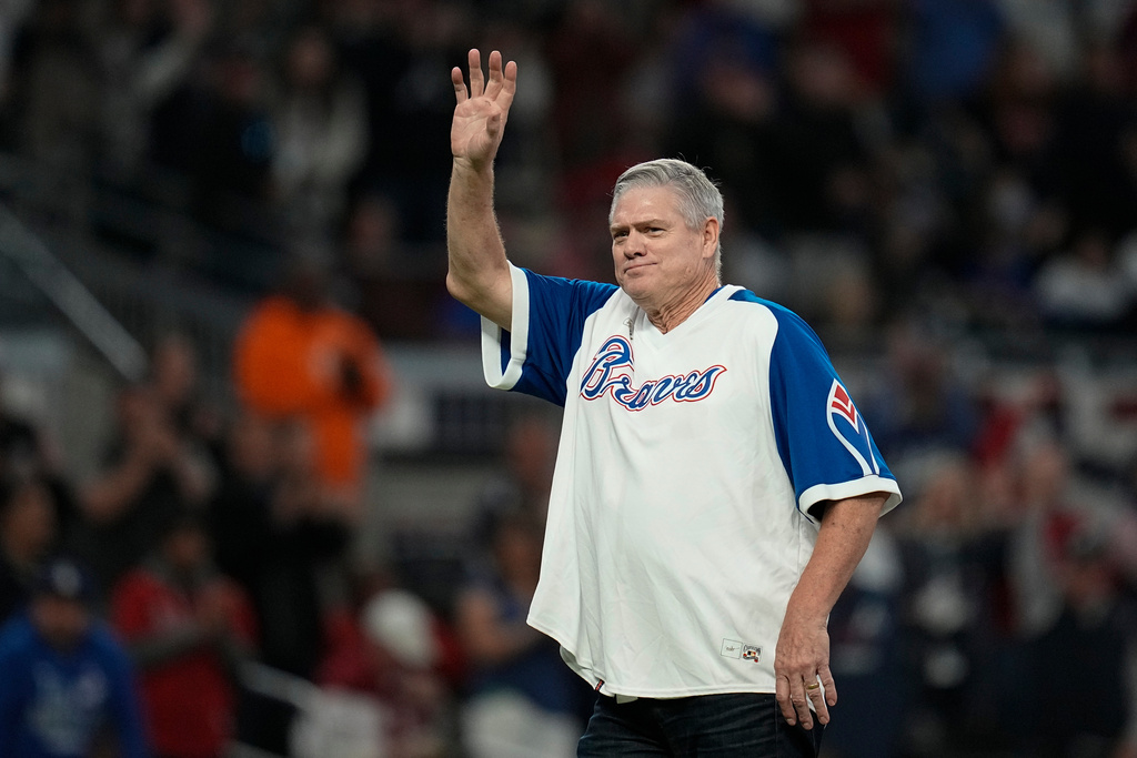 FILE - Former Major League Baseball player Dale Murphy waves to spectators before throwing out the ceremonial first pitch before Game 2 of baseball's National League Championship Series between the Atlanta Braves and the Los Angeles Dodgers Sunday, Oct. 17, 2021, in Atlanta. (AP Photo/Ashley Landis, file)