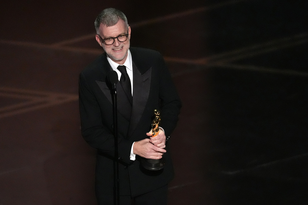 Paul Thomas Anderson accepts the award for directing for "One Battle After Another" during the Oscars on Sunday, March 15, 2026, at the Dolby Theatre in Los Angeles. (AP Photo/Chris Pizzello)