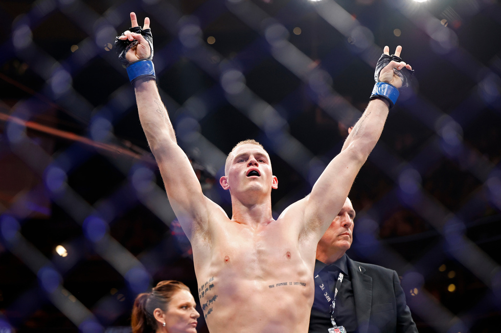FILE - Ian Machado Garry celebrates a win against Neil Magny during a UFC 292 mixed martial arts fight, Saturday, August 19, 2023, in Boston. (AP Photo/Gregory Payan, file)