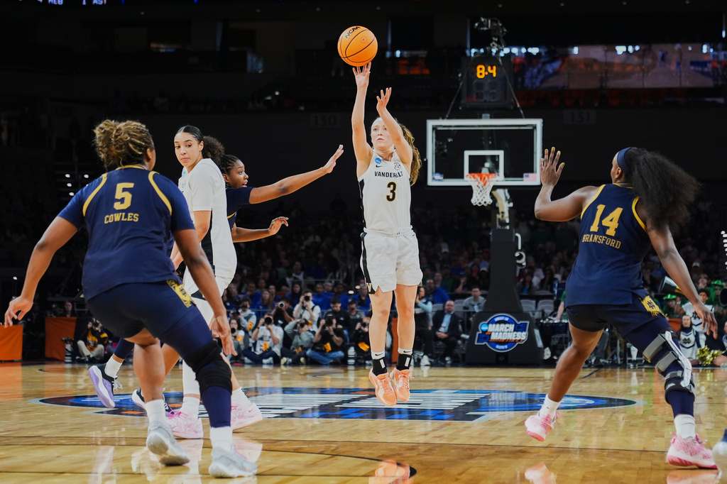 Vanderbilt guard Aubrey Galvan (3) shoots as Notre Dame's Malaya Cowles (5) and KK Bransford (14) defend late in the second half in the Sweet 16 of the NCAA college basketball tournament, Friday, March 27, 2026, in Fort Worth, Texas. (AP Photo/Julio Cortez)