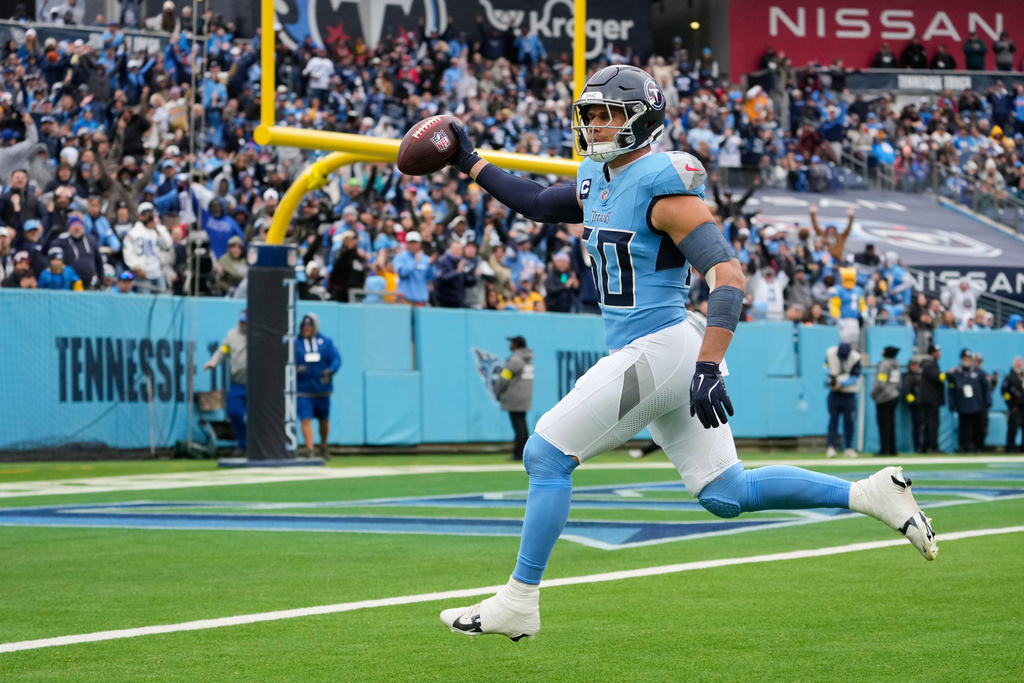 Tennessee Titans linebacker Cody Barton (50) returns an interception for a touchdown during the first half of an NFL football game against the Los Angeles Chargers, Sunday, Nov. 2, 2025, in Nashville, Tenn. (AP Photo/George Walker IV)
