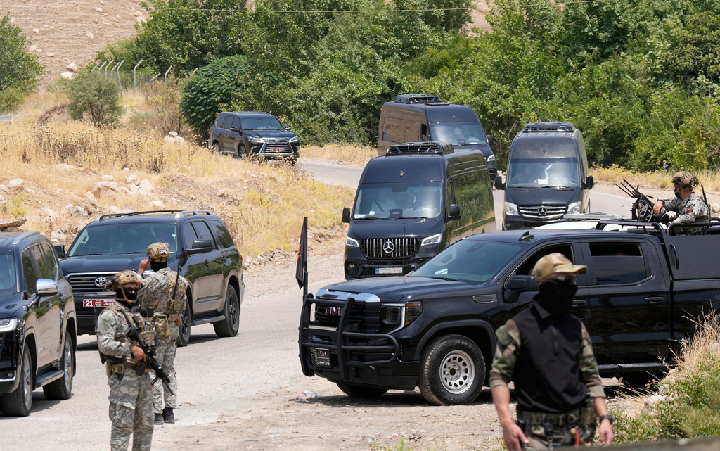 FILE - Forces of the regional Kurdish administration secure the area of the Jasana Cave ahead of a symbolic disarmament ceremony by the separatist PKK group as part of the peace process with Turkey, in Sulaymaniyah governorate, Iraq, Friday, July 11, 2025. (AP Photo/Hadi Mizban, File)