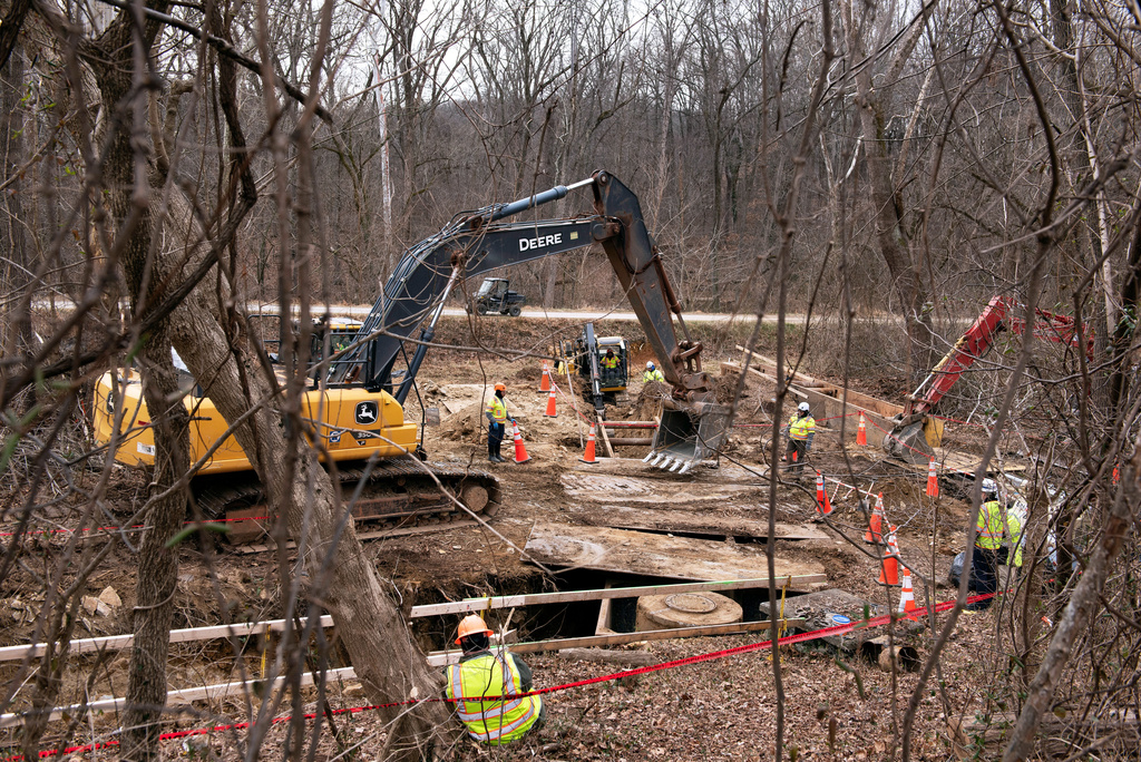 Work is taking place to contain raw sewage from flowing into the Potomac River after a massive pipe rupture, in Glen Echo, Md., Friday, Jan. 23, 2026. (AP Photo/Cliff Owen)