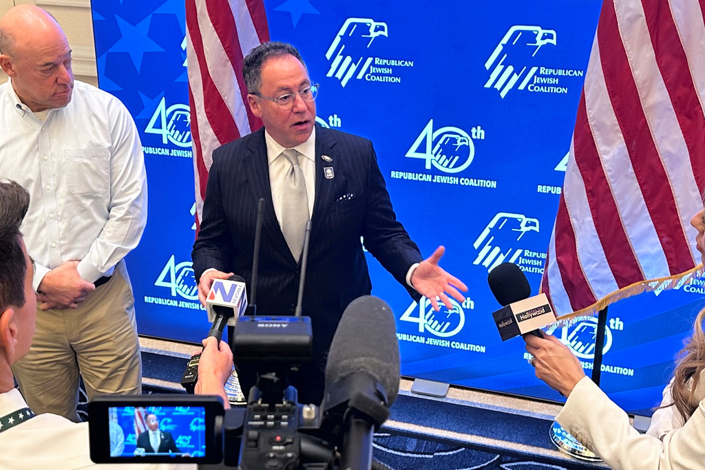 Republican Jewish Coalition CEO Matt Brooks, center, alongside Ari Fleischer, an RJC board member and press secretary to former President George W. Bush, answers questions from members of the news media about confronting antisemitism within the Republican Party, during the coalition's annual conference at the Venetian Resort in Las Vegas, Saturday, Nov. 1, 2025. (AP/Thomas Beaumont)