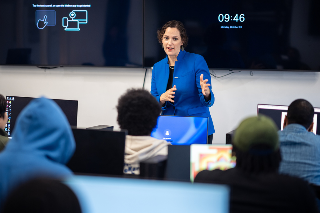 Caitlyn Brazill, President of Per Scholas, speaks to a Per Scholas class at the training center's Brooklyn Campus, Monday, Oct. 20, 2025, in New York. (AP Photo/Angelina Katsanis)