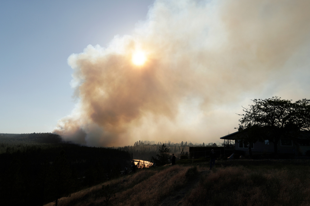 Old Trails Fire is seen from W. Northwest Blvd., Saturday, Aug. 1, 2026, in Spokane, Wash. (AP Photo/Young Kwak)