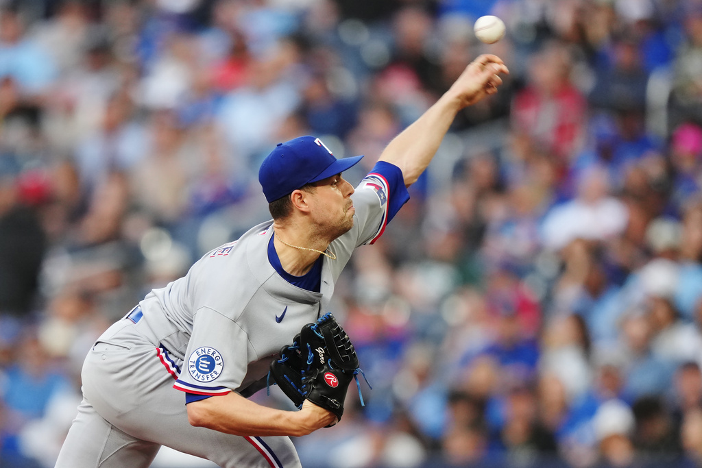 Texas Rangers pitcher MacKenzie Gore (1) works against the Toronto Blue Jays during the second inning of a baseball game in Toronto, Thursday, June 25, 2026. (Nathan Denette/The Canadian Press via AP)