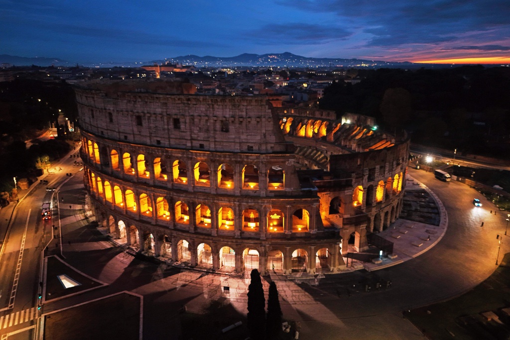 An aerial view of the Colosseum at sunrise, in Rome, Thursday, Dec. 4, 2025. (AP Photo/Alessandra Tarantino)