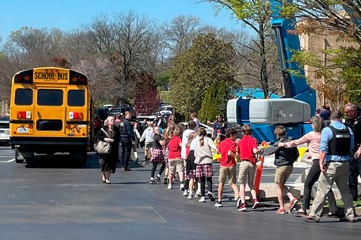 FILE - Children from The Covenant School, a private Christian school in Nashville, Tenn., hold hands as they are taken to a reunification site at the Woodmont Baptist Church after a deadly shooting at their school on March 27, 2023. (AP Photo/Jonathan Mattise, file) FILE - Children from The Covenant School, a private Christian school in Nashville, Tenn., hold hands as they are taken to a reunification site at the Woodmont Baptist Church after a deadly shooting at their school on March 27, 2023. (AP Photo/Jonathan Mattise, file)