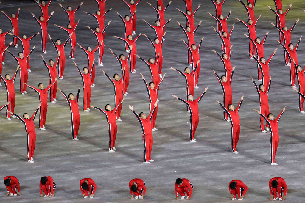 People perform mass gymnastics at the May Day Stadium in Pyongyang, North Korea, Thursday, Oct. 9, 2025, during the ceremony marking the 80th anniversary of the founding of the ruling Workers' Party. (AP Photo/Jon Chol Jin)