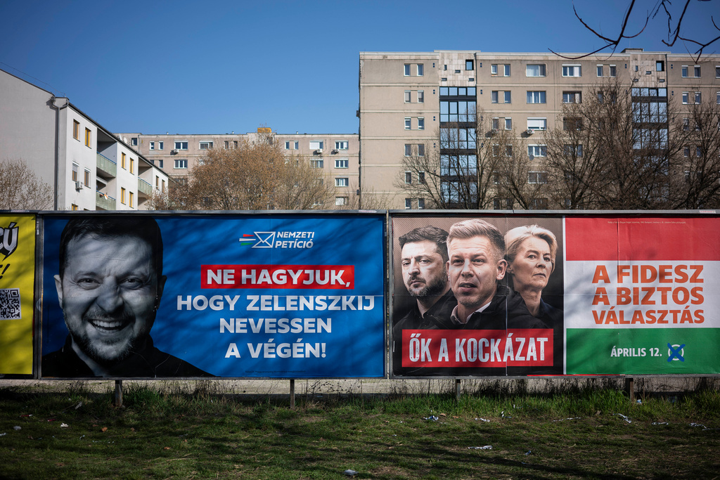 Campaign posters are displayed on the streets in Budapest, Hungary, on Saturday, March 14, 2026, ahead of the April 12 parliamentary election. (AP Photo/Denes Erdos)
