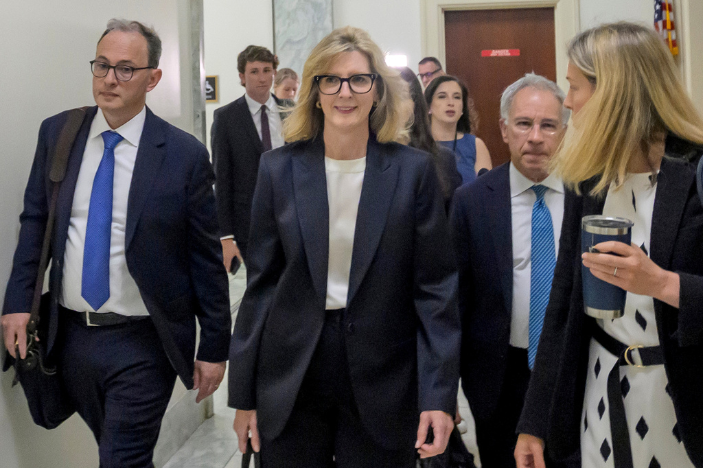 Goldman Sachs senior counsel Kathryn Ruemmler, center, arrives for a House Committee on Oversight and Government Reform hearing regarding her ties to Jeffrey Epstein, on Capitol Hill, Wednesday, July 15, 2026, in Washington. (AP Photo/Rod Lamkey, Jr.)