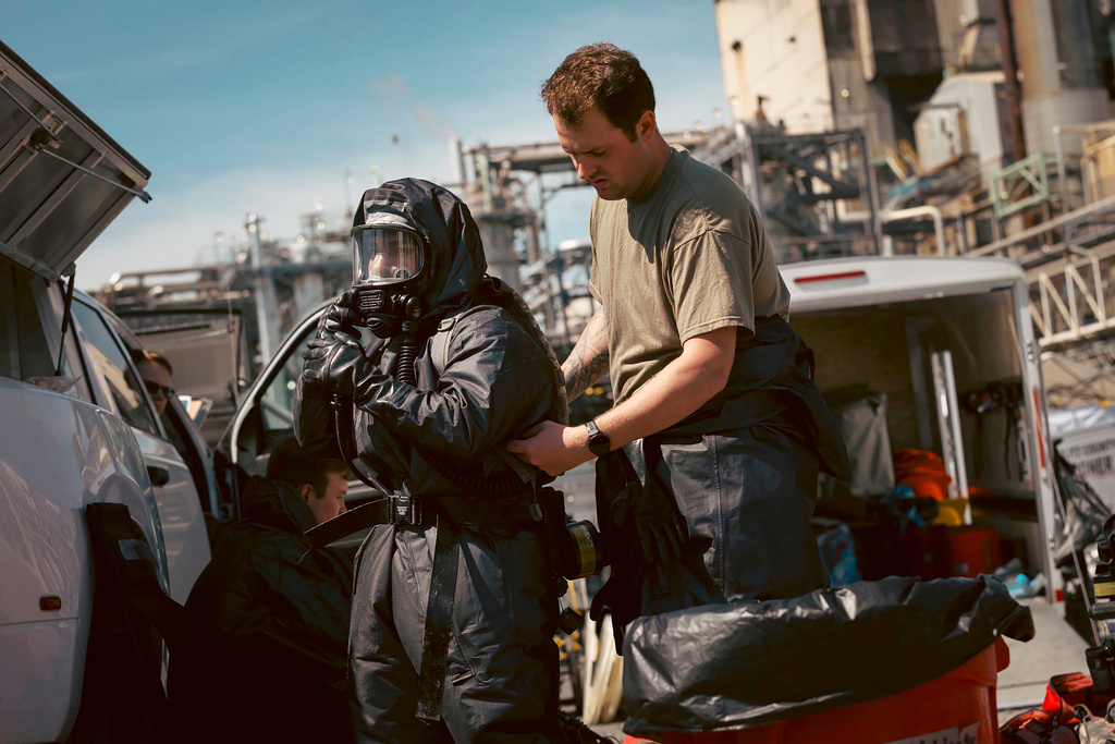 Soldiers and airmen from the Washington National Guard's 10th Homeland Response Force offer support to first responders following an implosion of a chemical tank at Nippon Dynawave pulp and paper mill on Thursday, May 28, 2026, in Longview, Wash. (Adeline Witherspoon/Washington National Guard via AP)