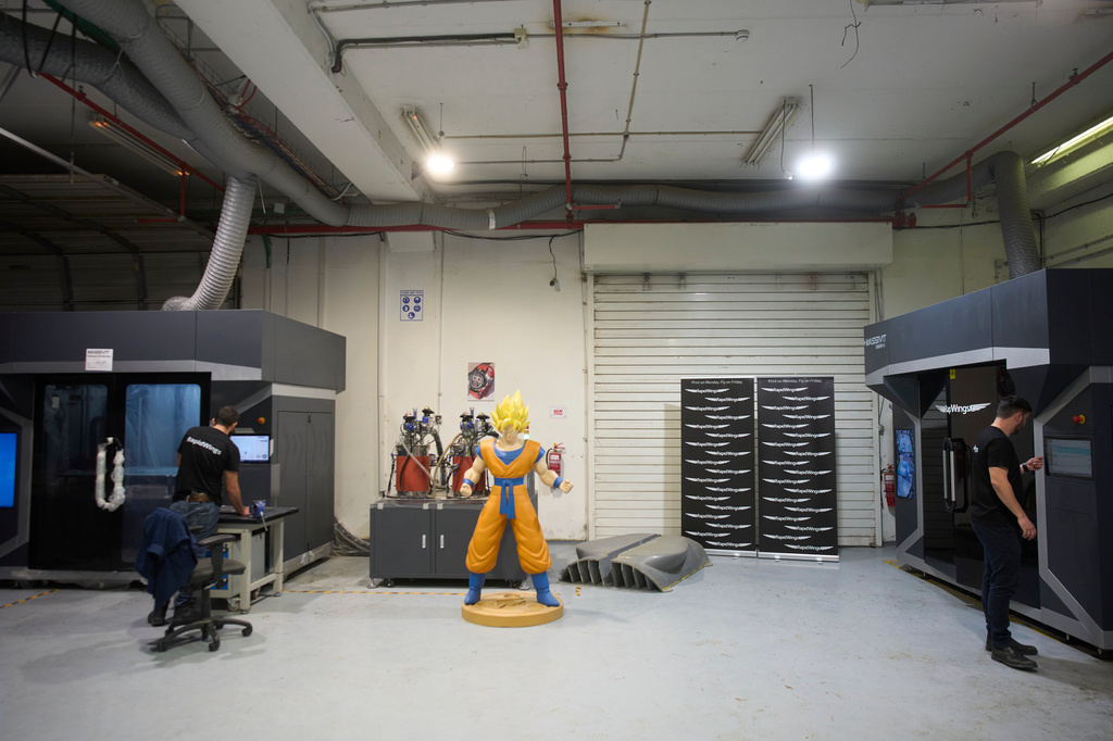 Workers operate a 3D printer that makes drone parts at the headquarters of Masssivit in Lod, Israel, March 30, 2026. (AP Photo/Ohad Zwigenberg)