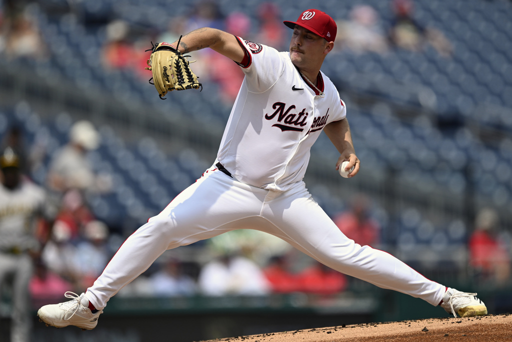 Washington Nationals starting pitcher Mitchell Parker throws during the first inning of a baseball game against the Athletics, Thursday, Aug. 7, 2025, in Washington. (AP Photo/John McDonnell)