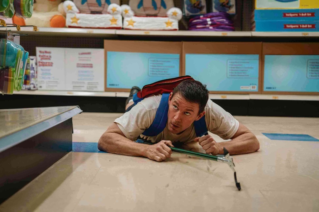 This image released by Paramount Pictures shows Channing Tatum in a scene from "Roofman." (Davi Russo/Paramount Pictures via AP)