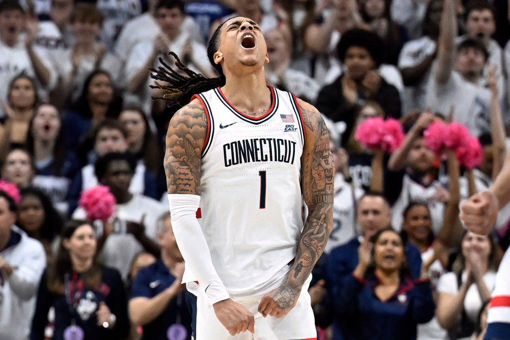 UConn guard Solo Ball (1) reacts in the first half of an NCAA college basketball game against Georgetown, Saturday, Feb. 14, 2026, in Storrs, Conn. (AP Photo/Jessica Hill)