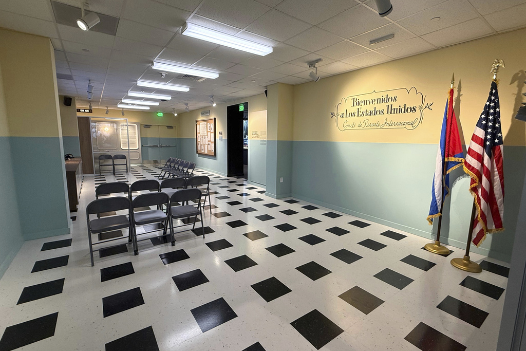A reproduction of the Cuban Refugee Assistance Program's main processing room is seen at the Freedom Tower in Miami on Friday, Aug. 8, 2025. (AP Photo/Joshua Goodman)