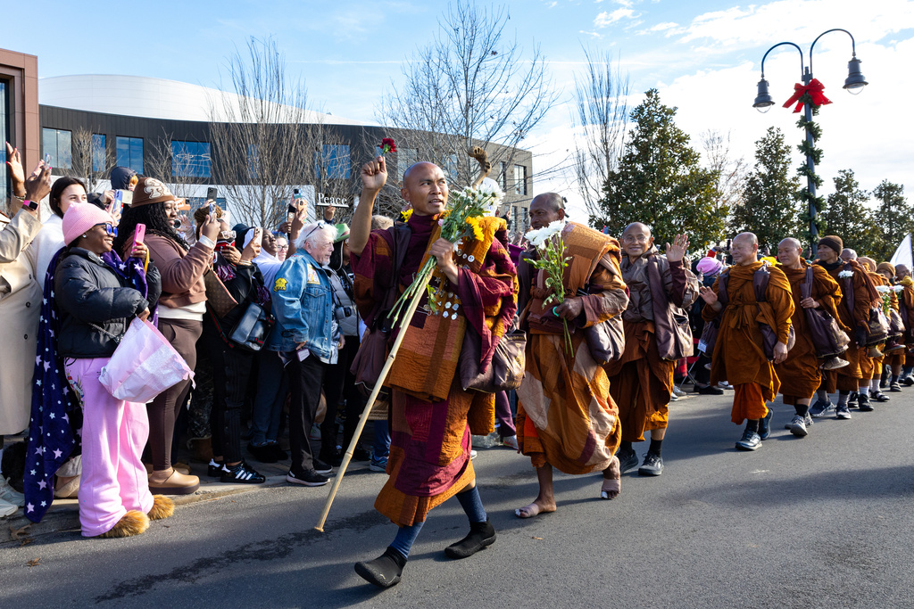 Buddhist monks on a "Walk for Peace" walk through Trilith in Fayetteville, Ga., on Monday, Dec. 29, 2025, from Texas to Washington, D.C. (Arvin Temkar/Atlanta Journal-Constitution via AP)