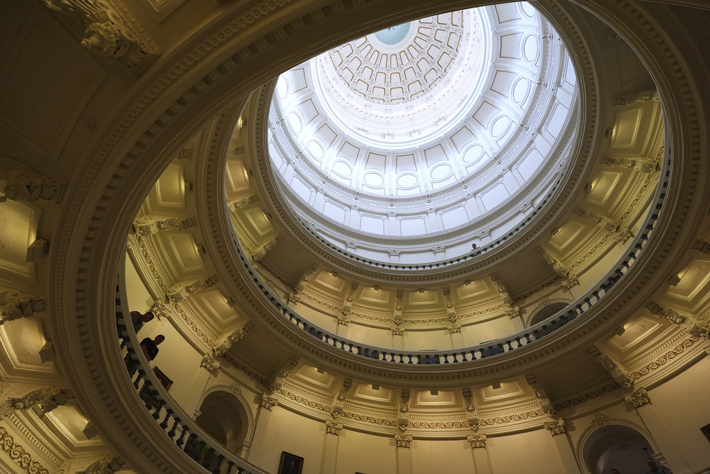 Texas state troopers post outside of the House Chamber where Democratic Texas state Rep. Nicole Collier refuses to leave due to a required law enforcement escort, Tuesday, Aug. 19, 2025, in Austin, Texas. (AP Photo/Eric Gay)