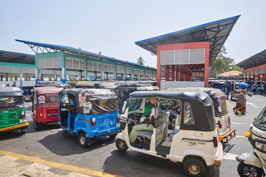 Commercial rickshaws drivers wait in line at a transport station in Freetown, Sierra Leone, March 7, 2026. (AP Photo/Abdul Hamid Kanu)